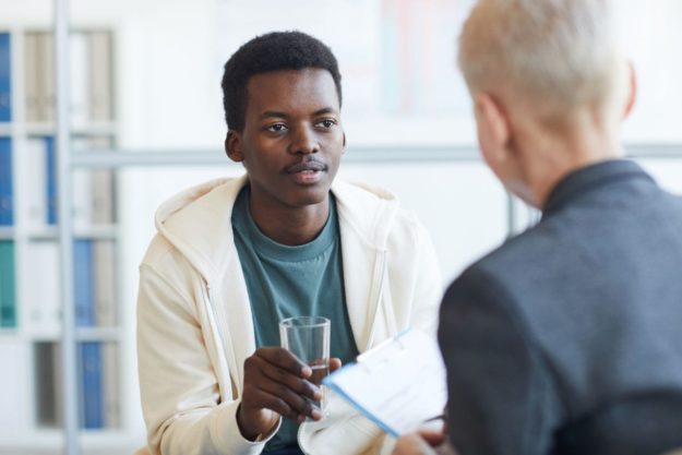 Addressing Substance Abuse in Young Adults man dressing substance abuse with a young adult seeking Addiciton treatment