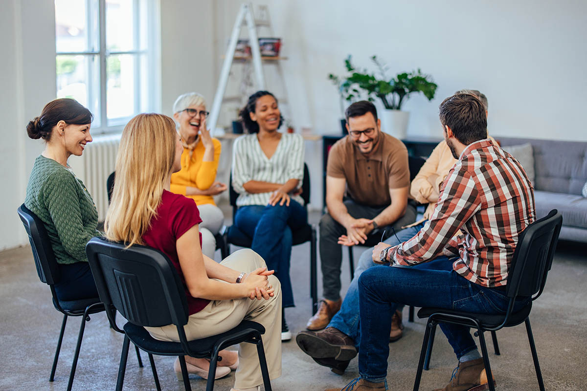 a group of people sit in a circle in chairs during a Pennsylvania drug rehab
