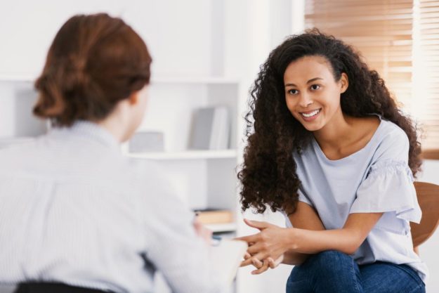 a person speaks with a therapist after learning cbt treatment plan for alcoholism