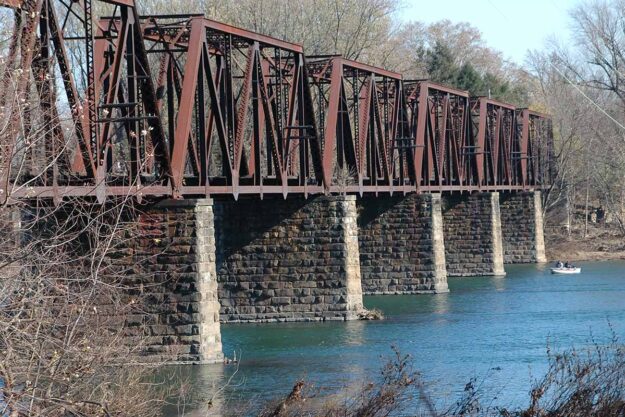 a rusted bridge over a river to show Residential Treatment Near Lewisburg PA