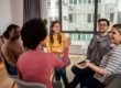 Five people sit in a circle, participating in an alcohol detox program in PA.