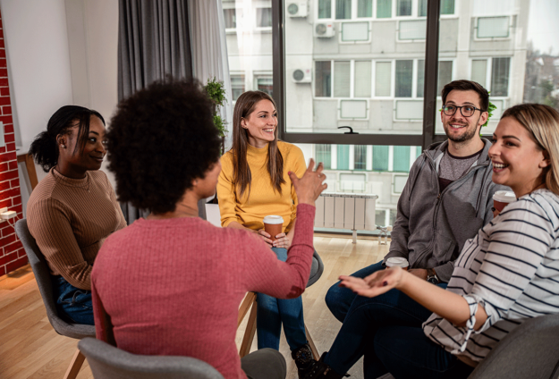 Finding-an-Alcohol-Detox-Center-in-Pennsylvania Five people sit in a circle, participating in an alcohol detox program in PA.