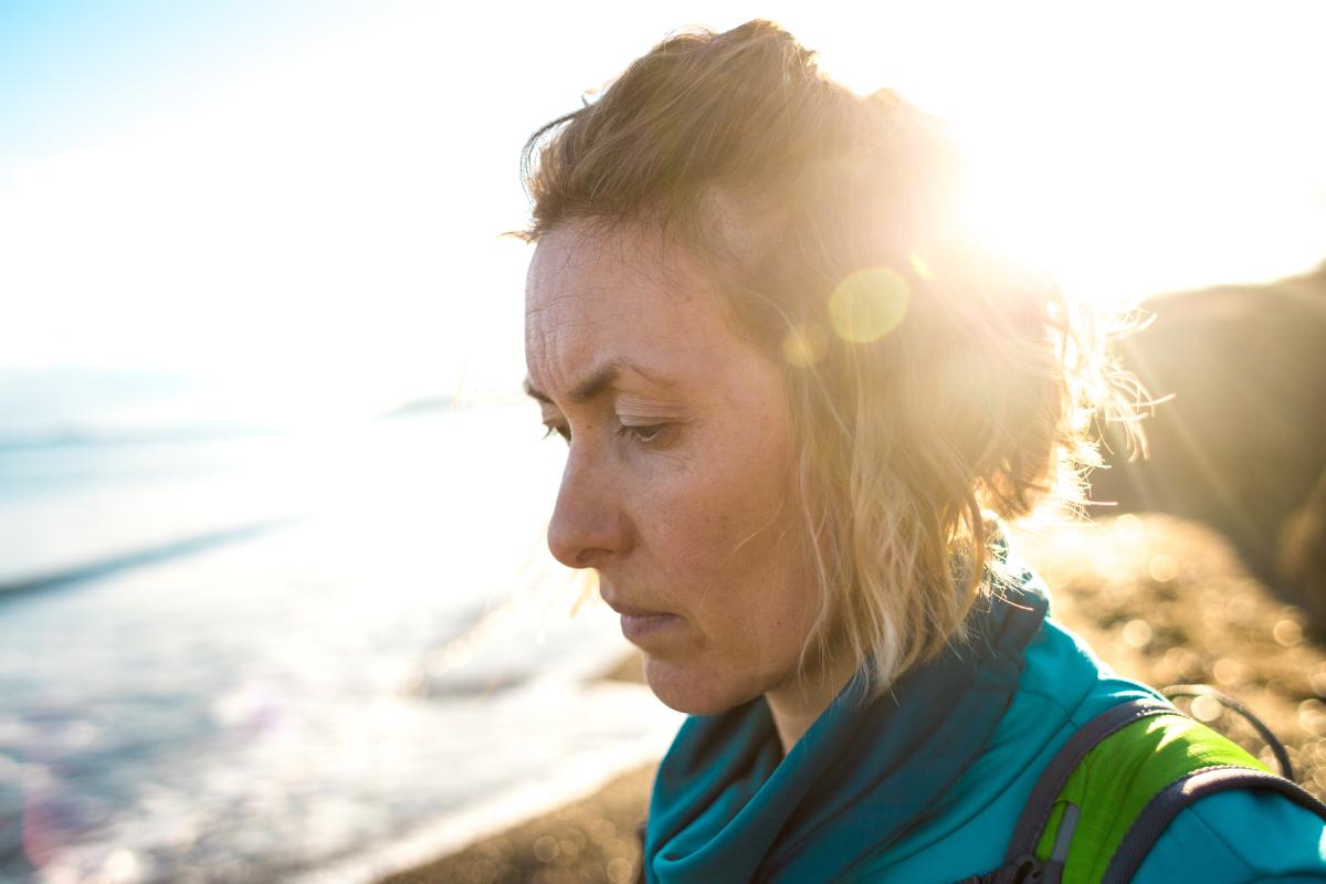 What Does Meth Withdrawal Look Like_ A woman on the beach is experiencing meth withdrawal symptoms.