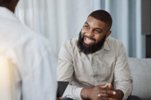 A man smiles while in relapse prevention therapy in Mechanicsburg, PA.