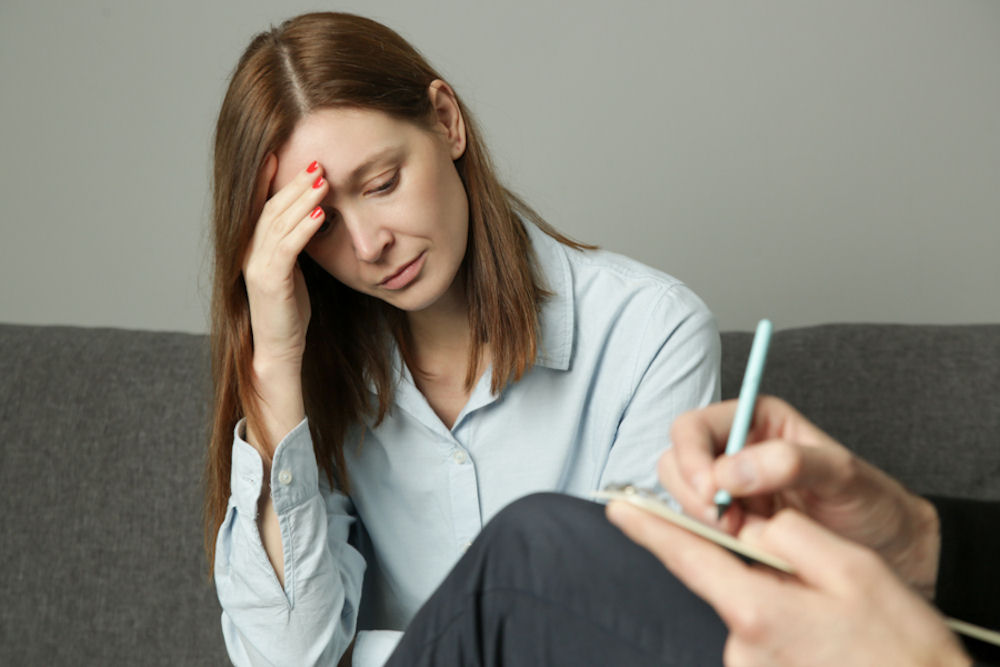 a-woman-with-hand-on-head-depressed