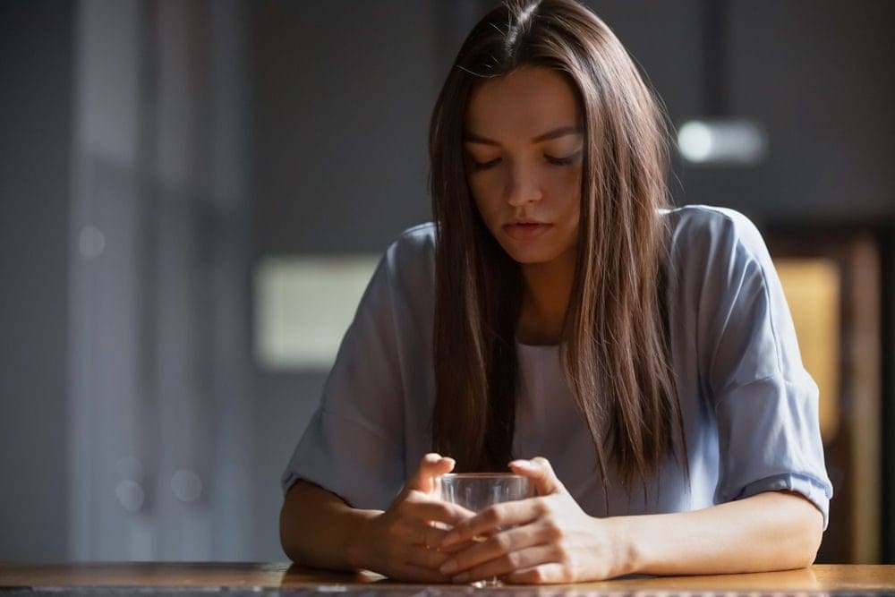 a-girl-holding-a-glass-of-alcohol