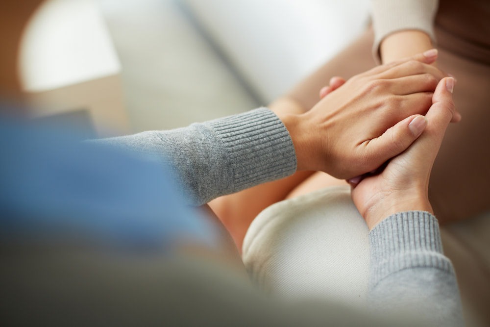 a woman's hands being covered in therapy